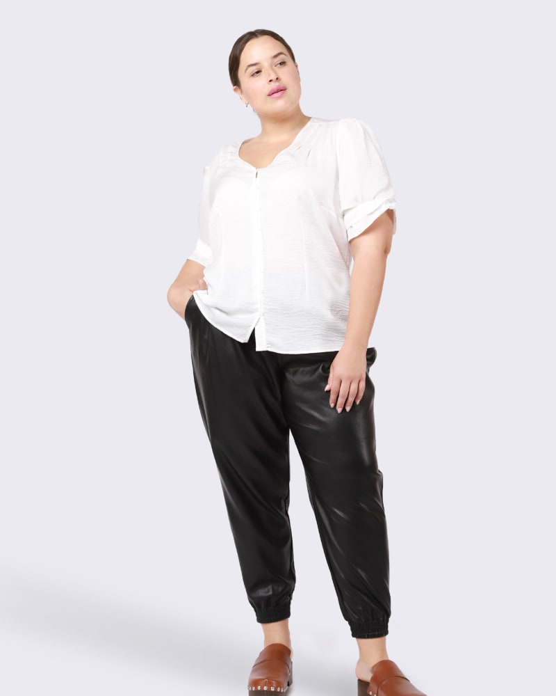 Front of a model wearing a size 0X Eugenie Ruffle Cuff Blouse in White by DEX PLUS. | dia_product_style_image_id:246214